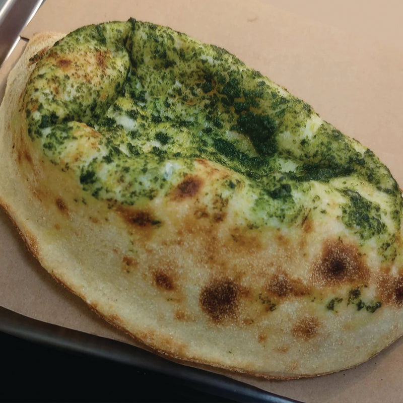 Delicate hand-folded calzones filled with creamy mozzarella, sweet caramelized onions, sauteed mushrooms, bright cherry tomatoes, and peppery arugula