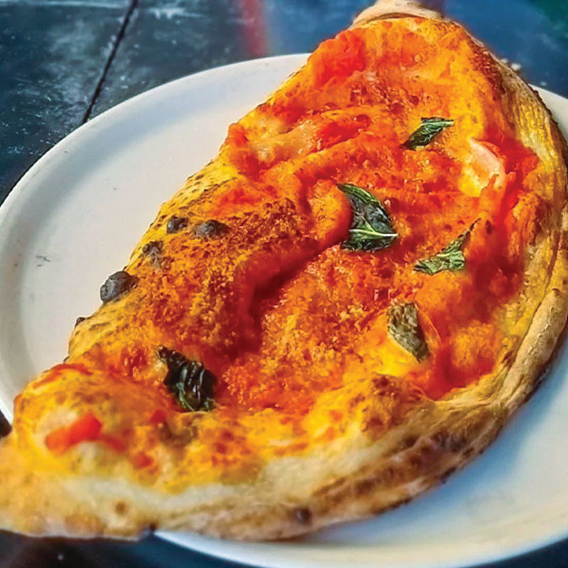 crispy-edged calzone pocket filled with traditional tomato sauce, melted mozzarella, sharp parmesan, and cracked black pepper