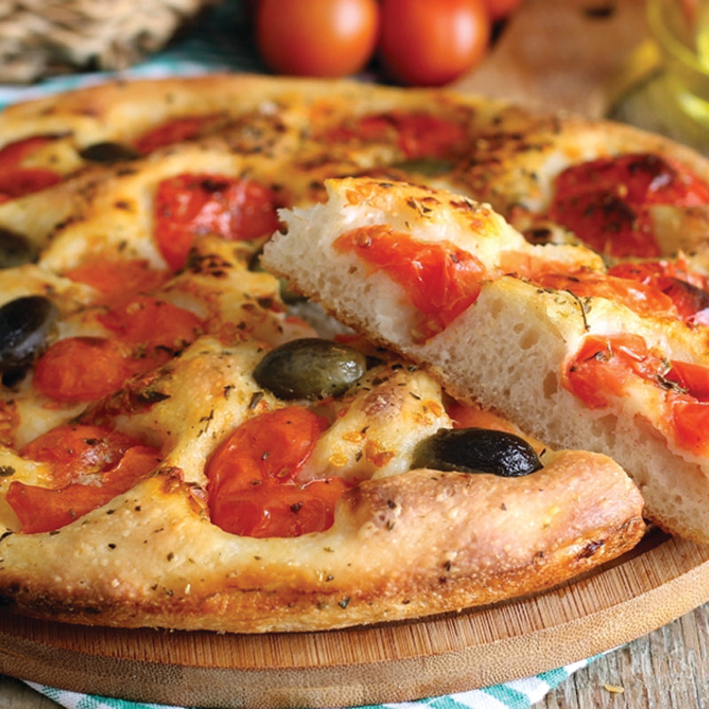 Italian Catering Focaccia barese with tomatoes and olives on a wooden board