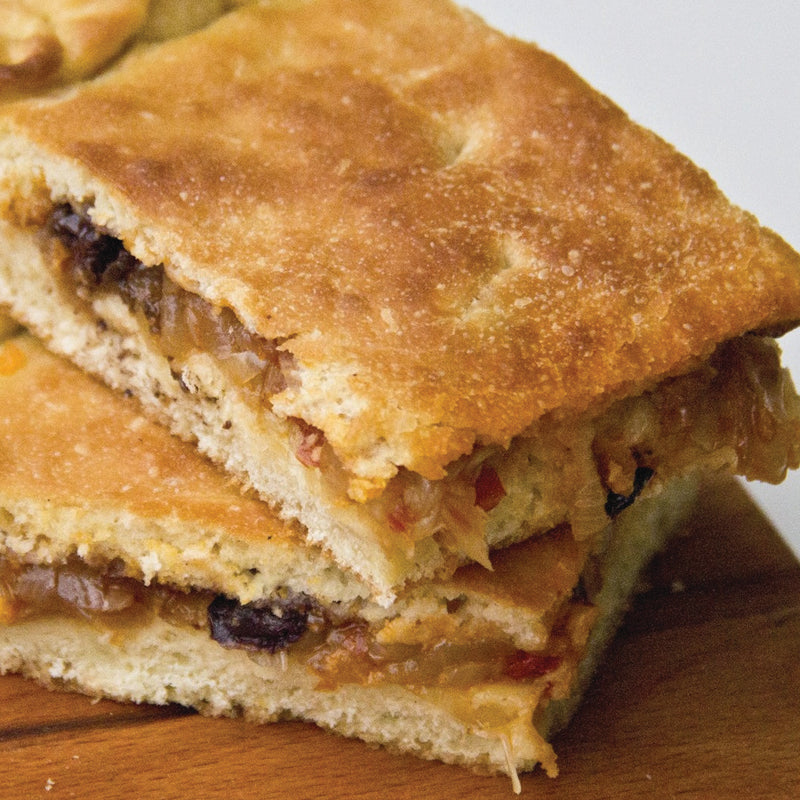 Italian Catering focaccia lucana with caramelized onion and black olives