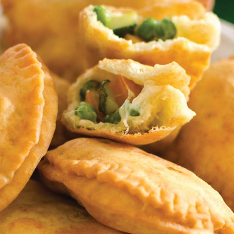 panzerotto Creamy vegan mozzarella melts alongside caramelized onions, sauteed mushrooms, and bright cherry tomatoes, finished with arugula