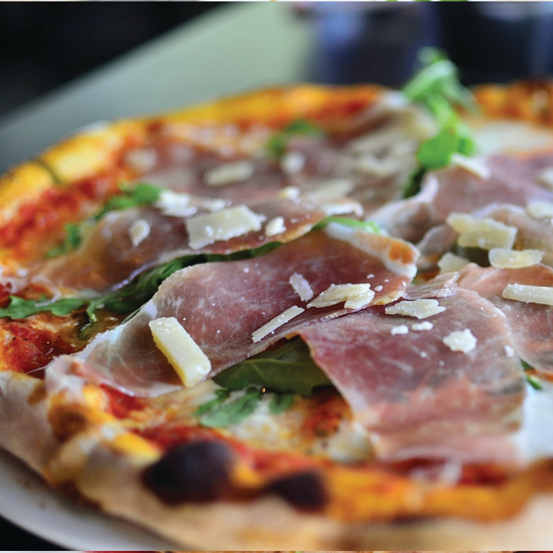  16" Parma pizza. Topped with tomato sauce, creamy mozzarella, shaved parmesan, and delicate parma prosciutto, 
