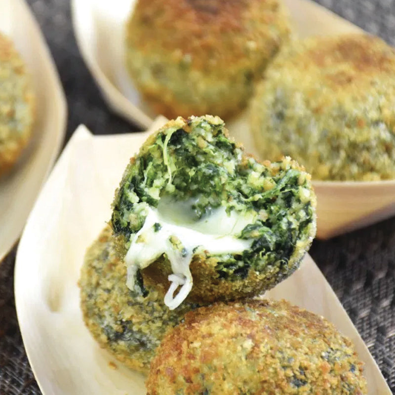 Spinach falafel with melted cheese on a plate