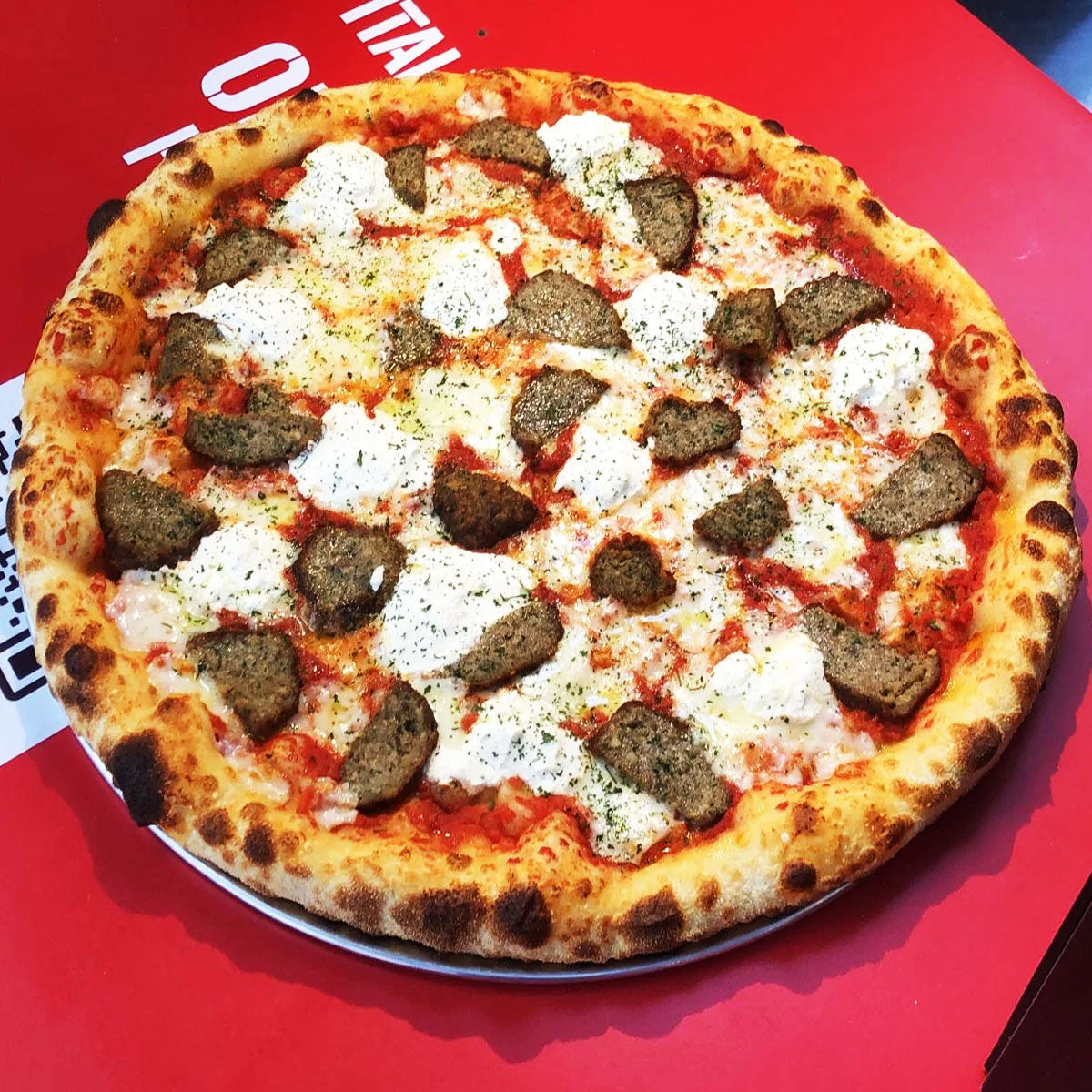 A 16-inch pizza showcasing the classic pairing of creamy ricotta and savory meatball. Built on tomato sauce and melted mozzarella, each slice delivers tender meatball with smooth ricotta dollops that meld into the cheese. 